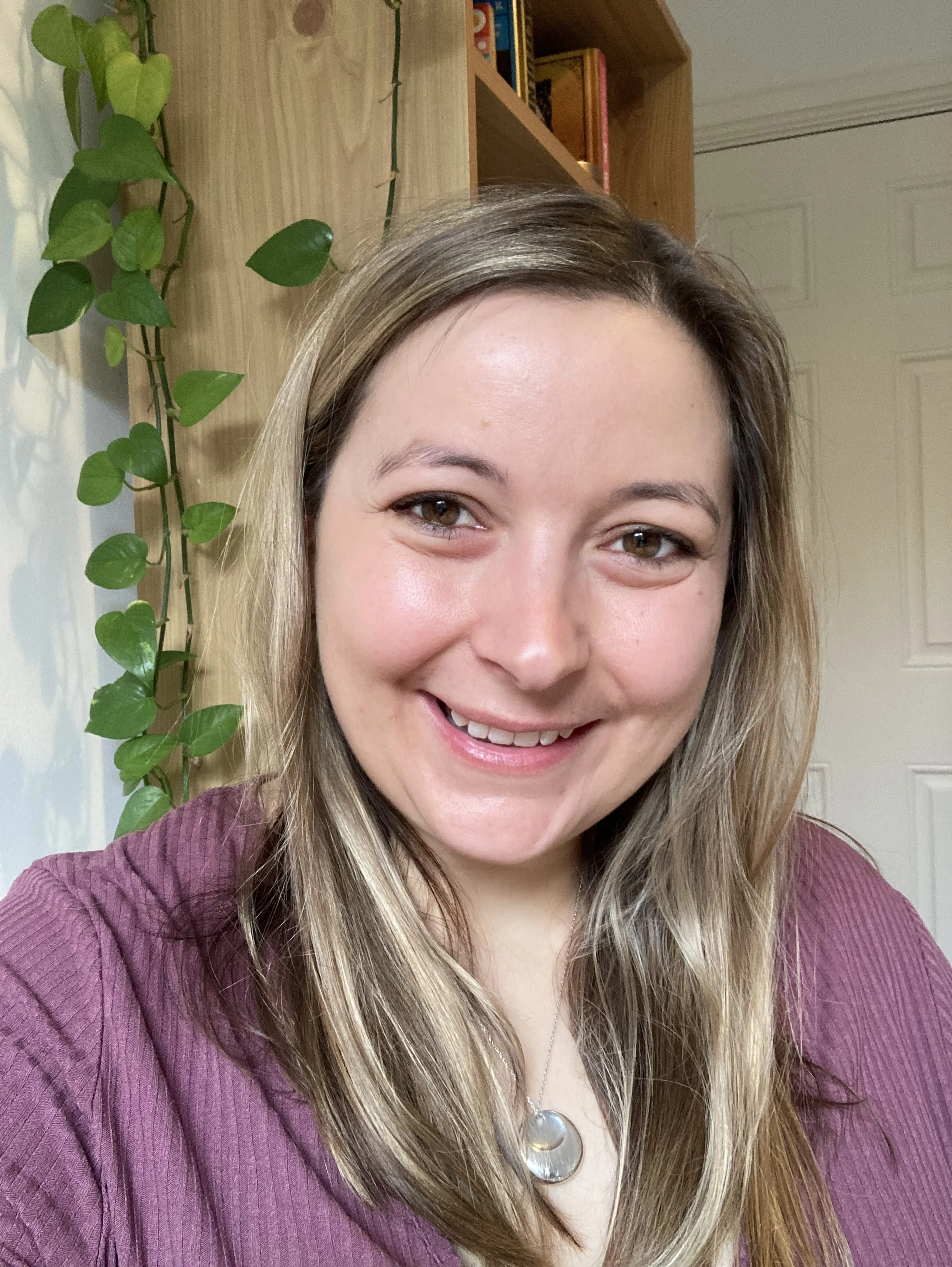 Emily at desk doing 1:1 coaching