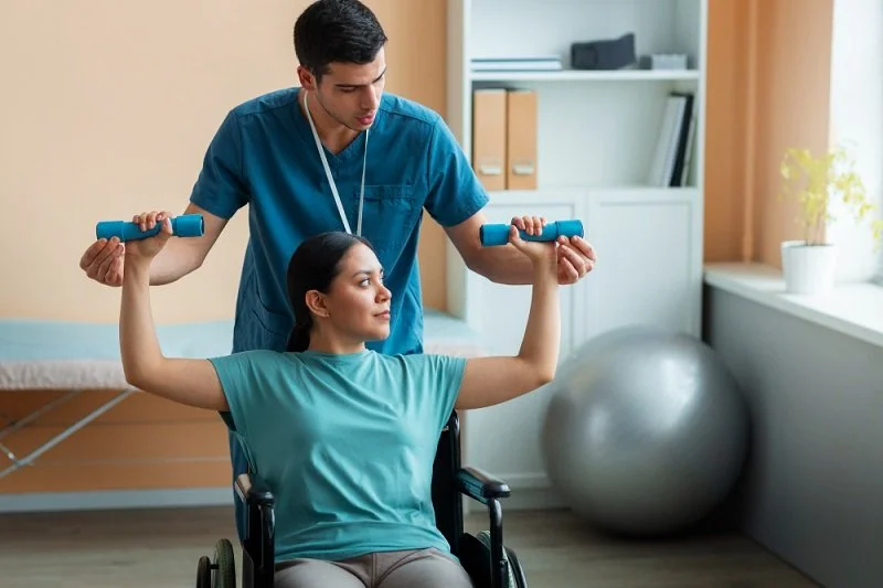 Physical therapist assisting patient with accident recovery exercises
