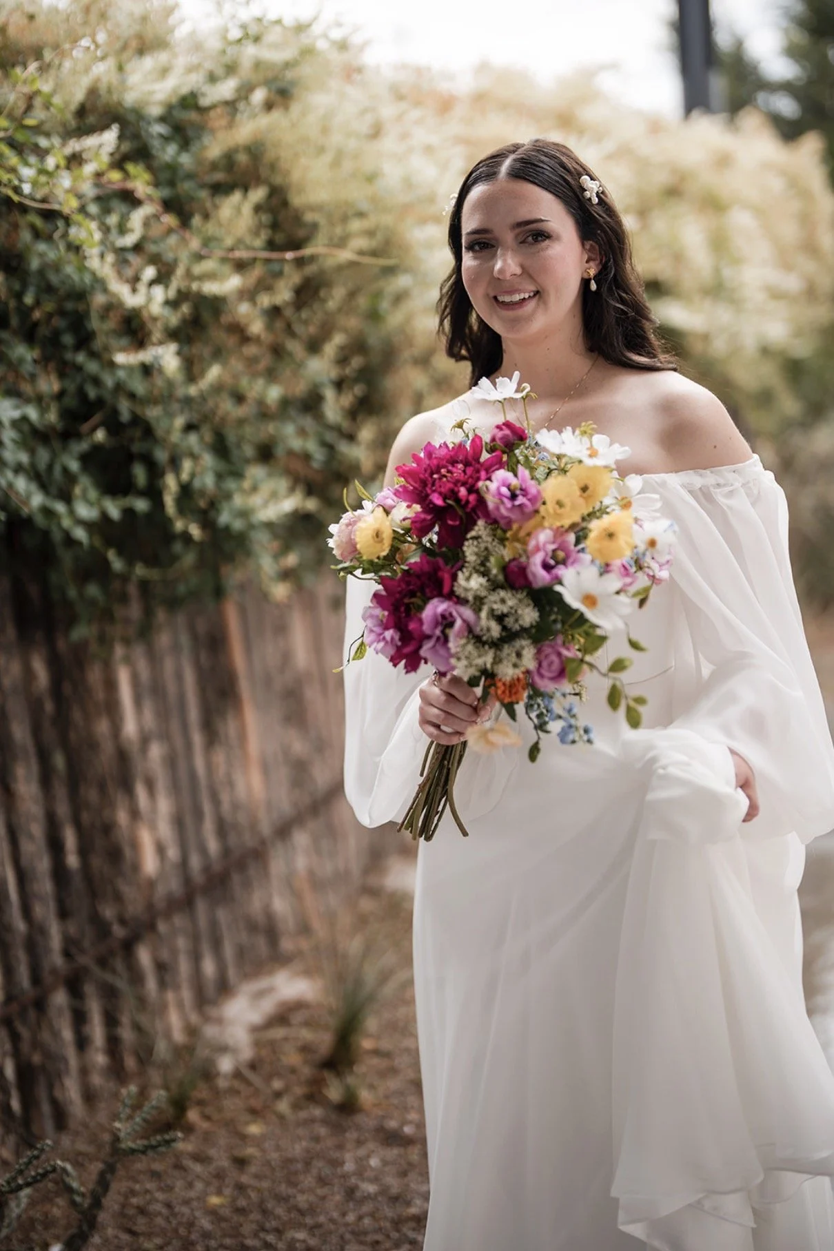 bride portrait wildflower bouquet off shoulder wedding gown The Mystic Santa Fe Casey Addason Photography