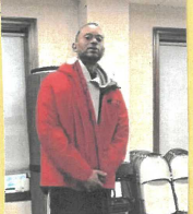 Man in red jacket.