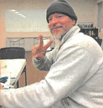 Man with victory sign