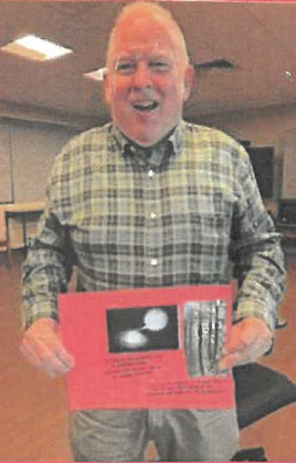 White man holding collage