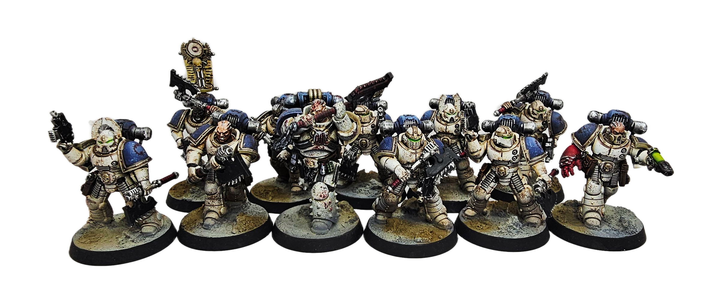 Group of painted miniature sci-fi soldiers in armor holding weapons, standing on round bases with textured terrain.