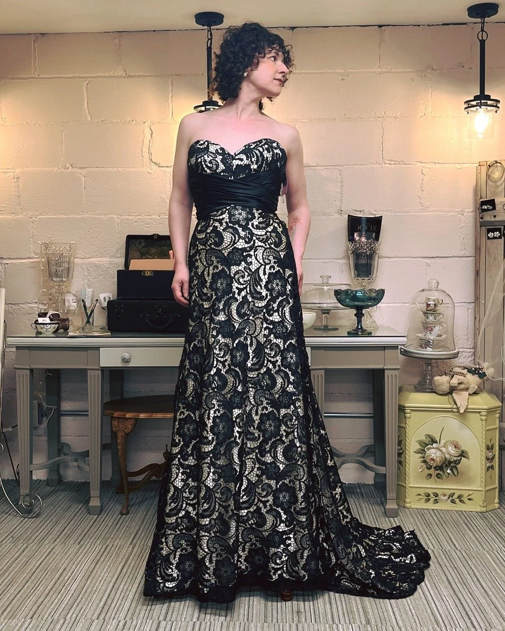 First pictures from yesterday's photoshoot with Abigail Marcus. Highlighting a couple of our gowns that are more non-traditional. If you are the bride that wants a black wedding gown, we have one! Loving the sparkle and 70s bell sleeves on the ivory/