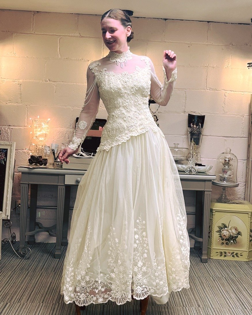It's Wedding Wednesday! We're highlighting this beautiful 1970's vintage gown. The embroidery and beadwork is stunning and the addition of the pleated ruffle on the train is sweet as can be! Thanks again Abigail Marcus for modeling. #brideonabudget #