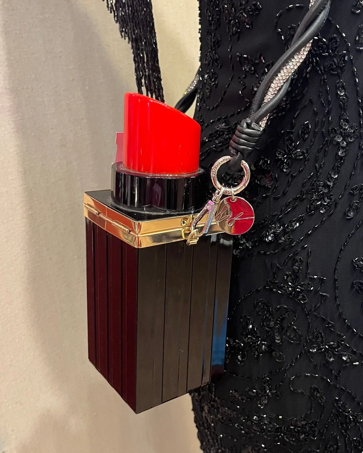 Here's yesterday's style challenge! We styled this rad lipstick purse! Thanks to Danielle, Gabe, and Jordan for styling. #kismet #kismetconsignment #kismetmoment