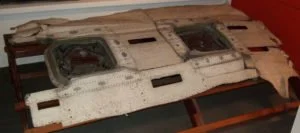  This is the actual fragment skin that peeled off the de Havilland Comet G-ALYP, retrieved from the ocean floor, that allowed investigators to figure out the flaw that caused several crashes. This changed how jet airliners were made forever. 