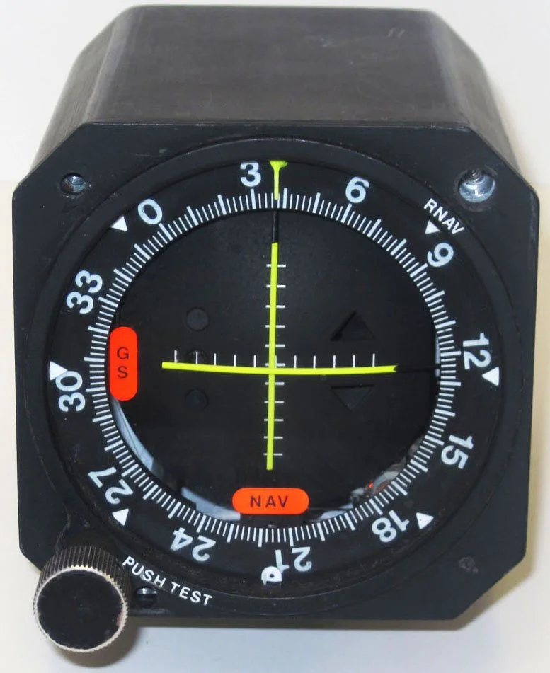  An older-style analogue VOR instrument shows the needles neatly crossed in the middle to show the aircraft is in the correct space horizontally and vertically. 