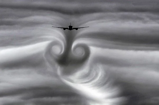  What causes turbulence? The effects of wake or aerodynamic turbulence are beautifully illustrated here as this aircraft passes through clouds. 