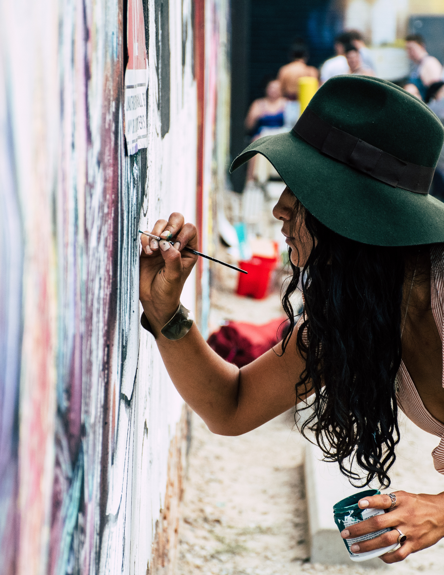 woman painting a mural
