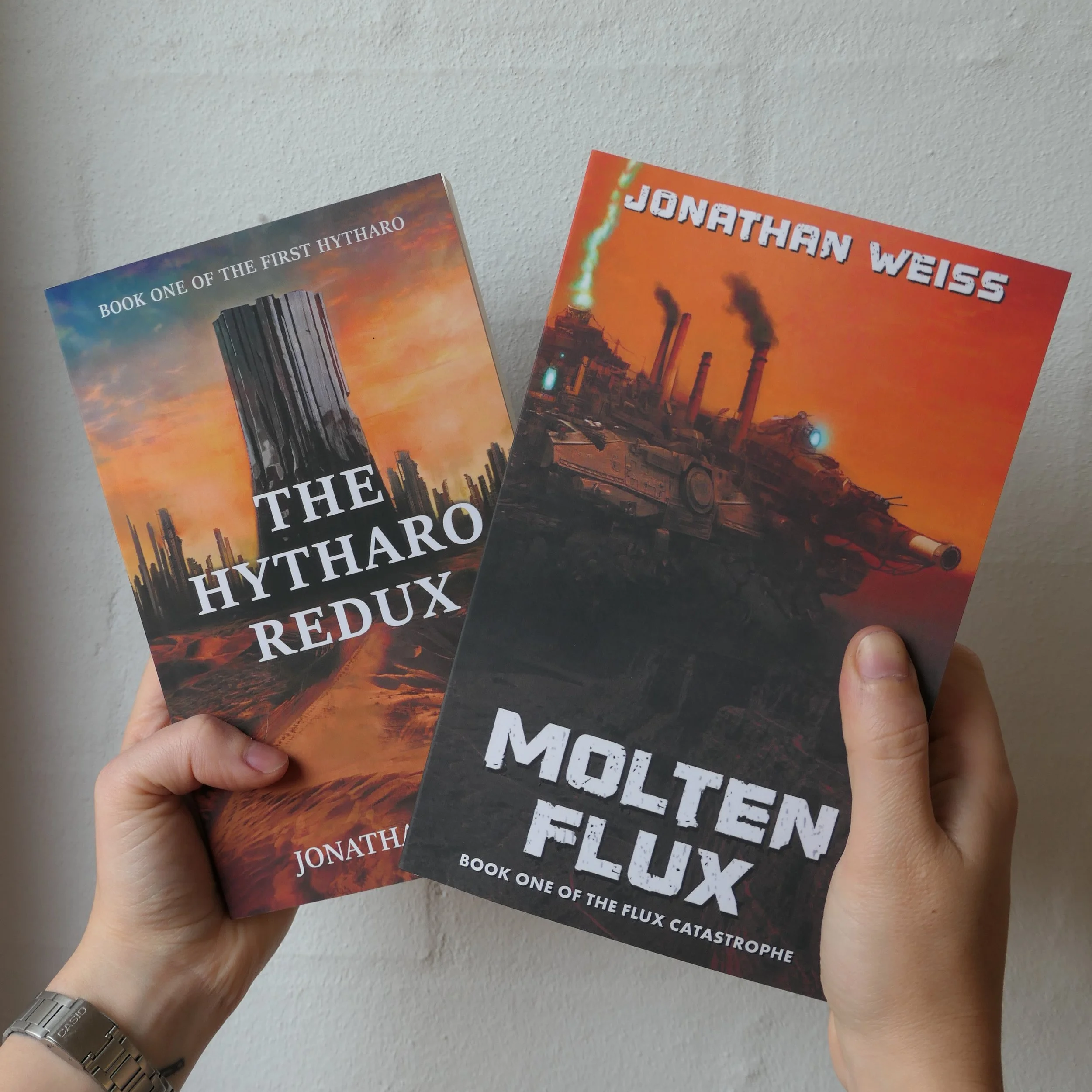 Paperback copies of Molten Flux and The Hytharo Redux, both novels written by Australian author Jonathan Weiss