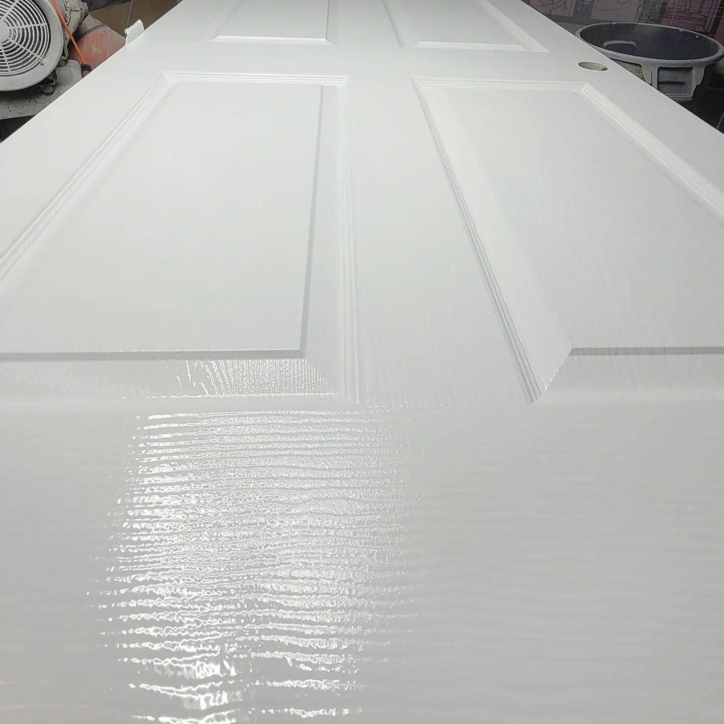 While I'm at it. May as well post another one of this week's completed projects. This dusty looking primed door from Home Depot has been &quot;Command-ed&quot; by me to be gloss white. Command is a urethane paint brand under the Corontech label made 