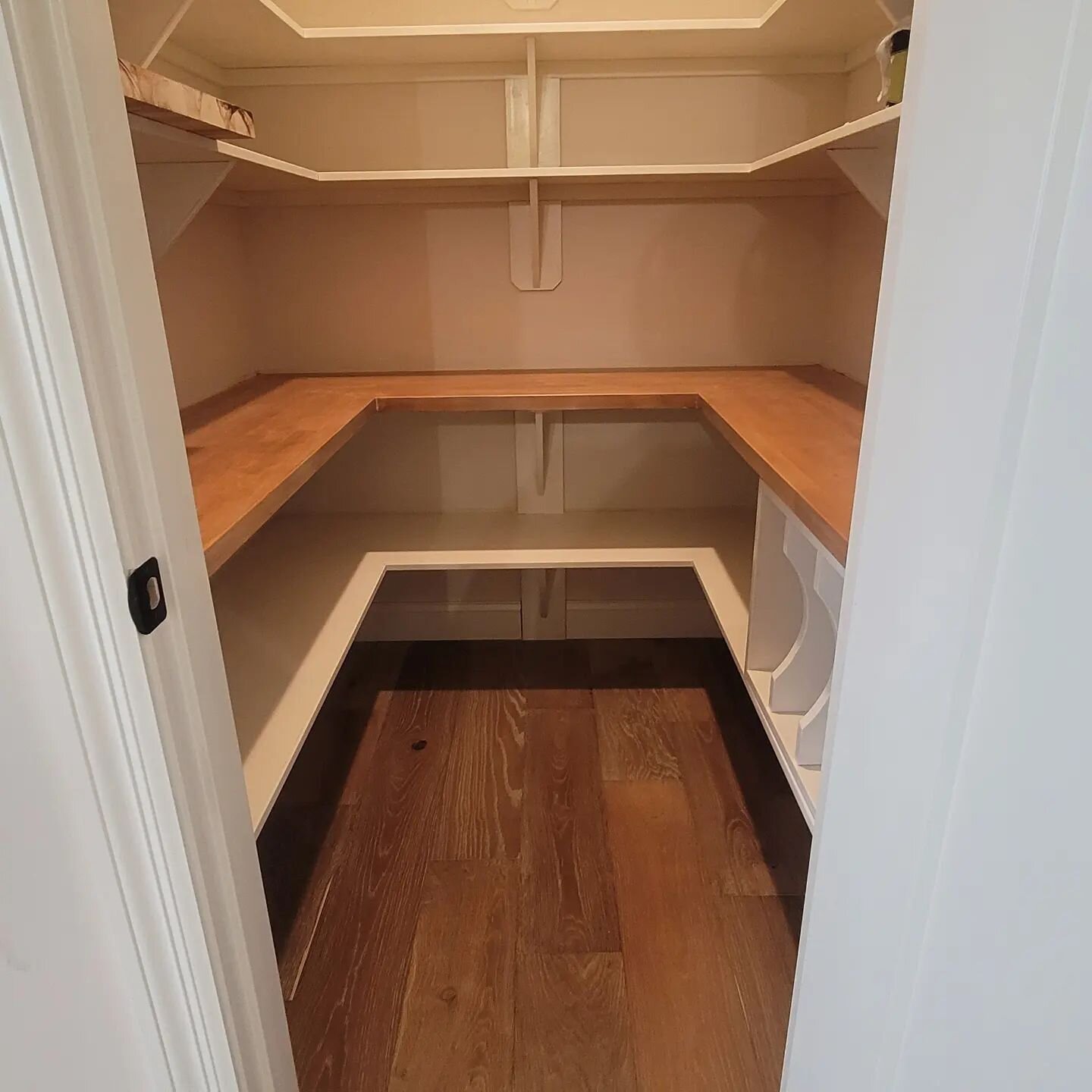 One of this week's projects was to paint the shelves and stain the maple butcher's block in this walk-in pantry. This customer had the wire shelves replaced with wood and added the butcher's block. The shelve's color is &quot;Alabaster&quot; in Miles