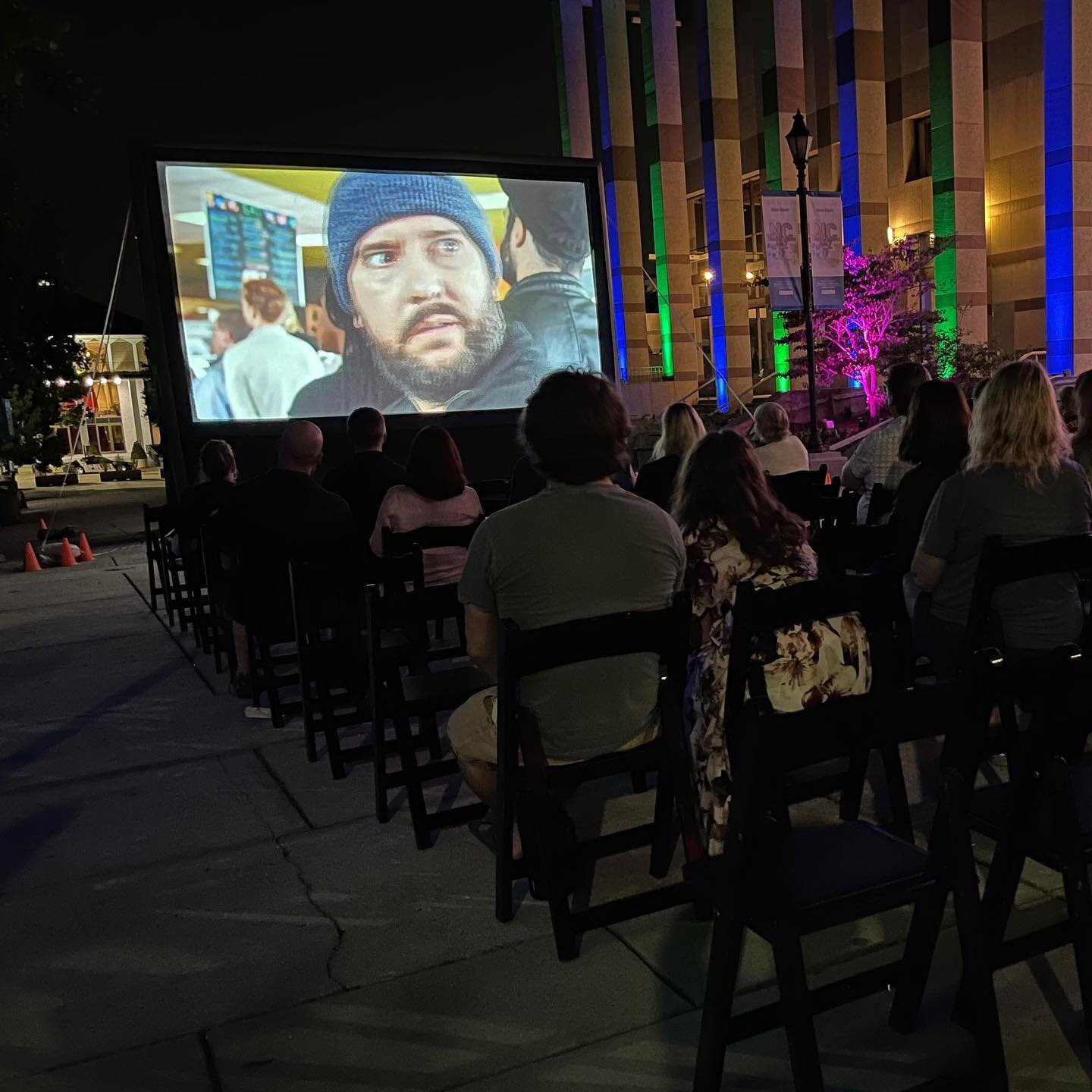 We had a great time last night at Movies-N-Moonlight, part of the 2023 Longleaf Film Festival in downtown Raleigh. The face on the big screen belongs to Michael Howard, one of our OH CRAPPY DAY performers, starring in a comedy short called &ldquo;The