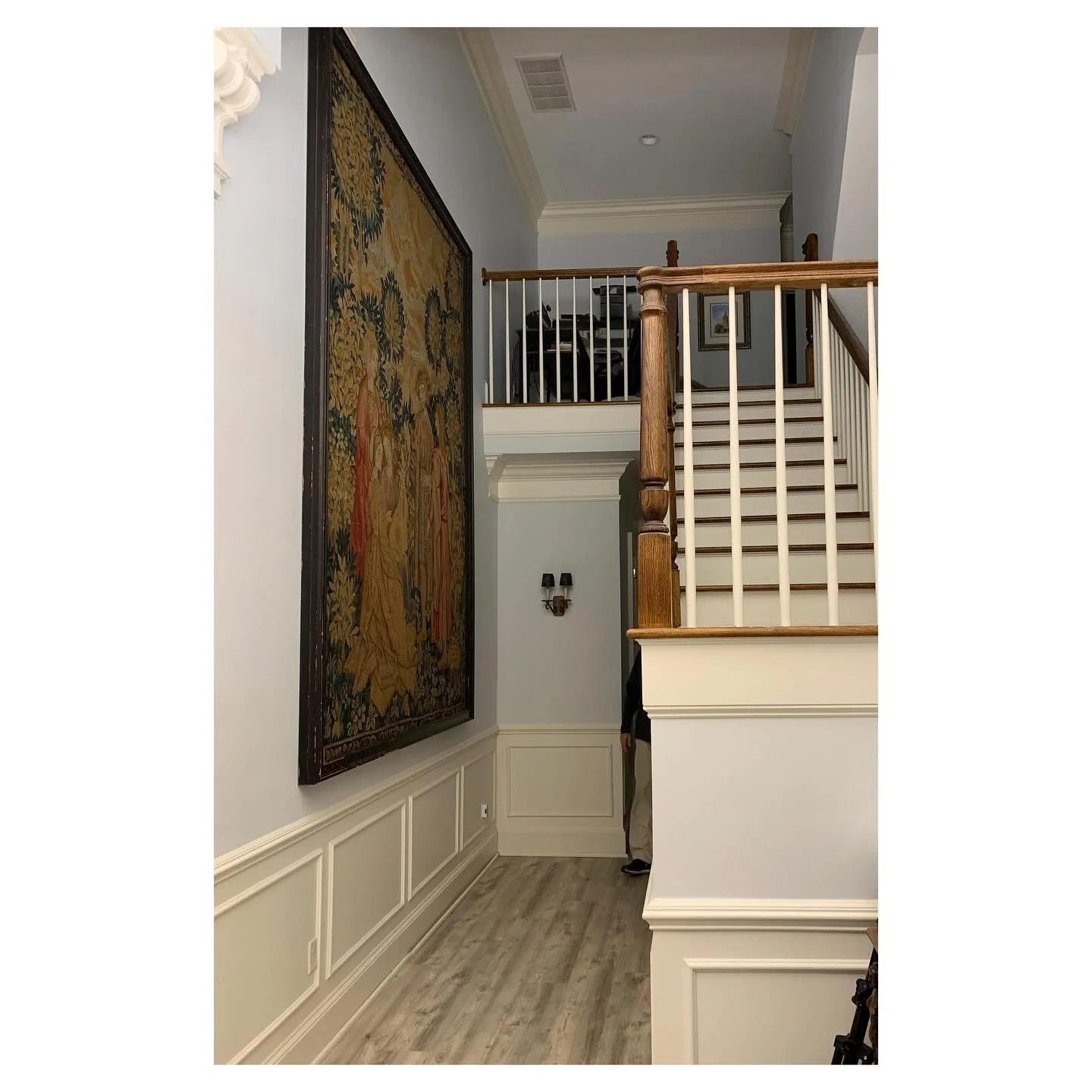 This stunning tapestry was carefully framed and hung in place, with the frame so large (8ft wide by 10ft tall) it had to be assembled inside the home. A seamless blend of craftsmanship and precision, creating a dramatic focal point for this grand ent