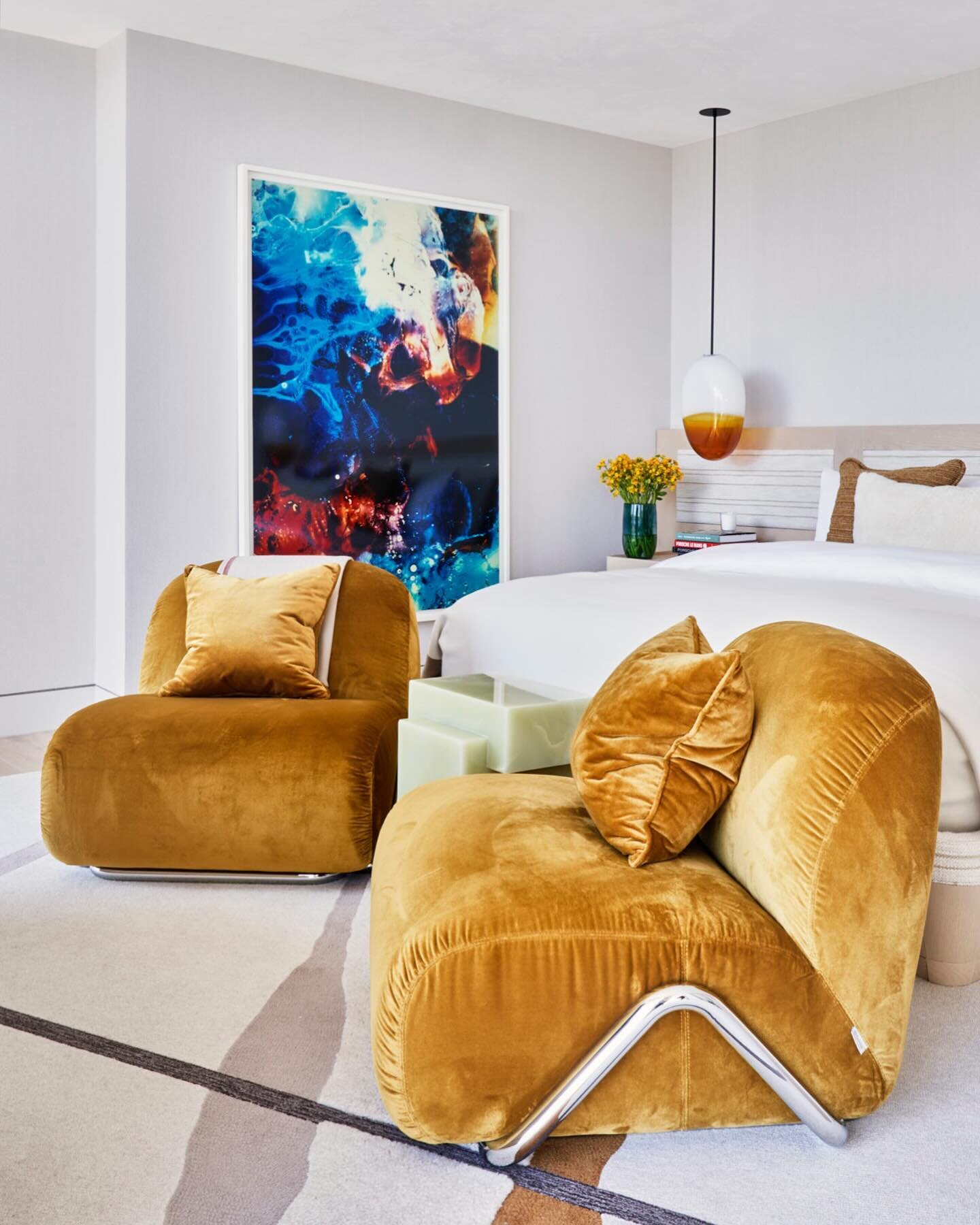 An artwork by Matt Saunders in a guest bedroom of an oceanfront penthouse.  The rug is by George Nakashima for Edward Fields, the chairs are by David and Nicholas, and the bed is custom by TORREY. 

Interior design by @torreyllc 
Lighting design by @