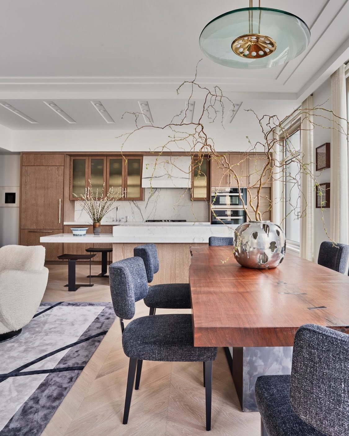 Artworks by Gabriel de la Mora and Mary Corse join stools by Pierre Chareau, a chair by Vladimir Kagan, an important Fontana Arte light fixture by Max Ingrand, and commissioned dining table by Stefan Rurak in a Noho Loft.  The dining chairs are custo