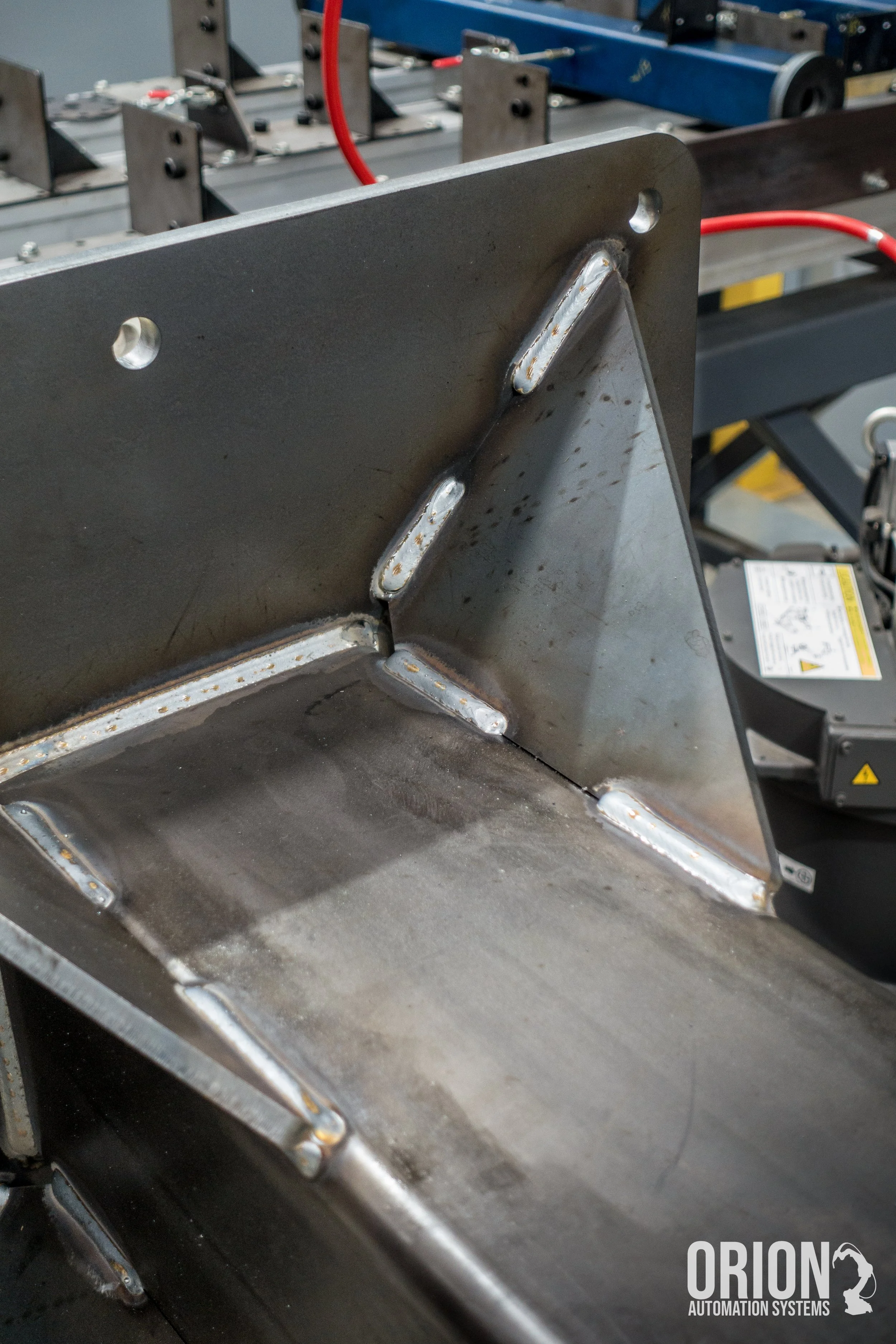 Industrial pedestal with robotic welds
