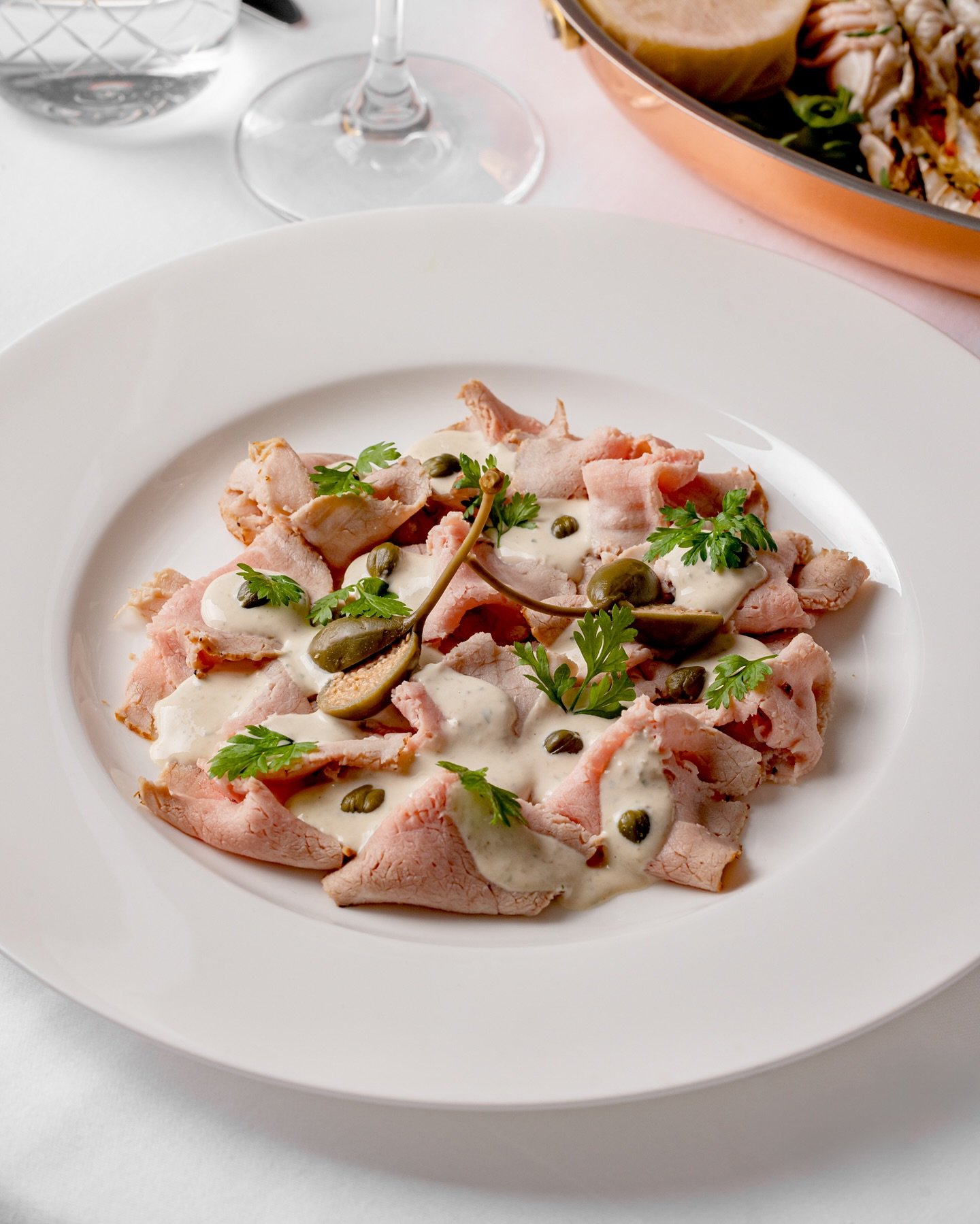 Reimagined by our talented chefs, indulge in the flavours of la dolce vita with our Vitello Tonnato. Chilled thinly sliced veal paired with tuna in a seasoned caper sauce await you.

Savour our menu via the link in thew bio.