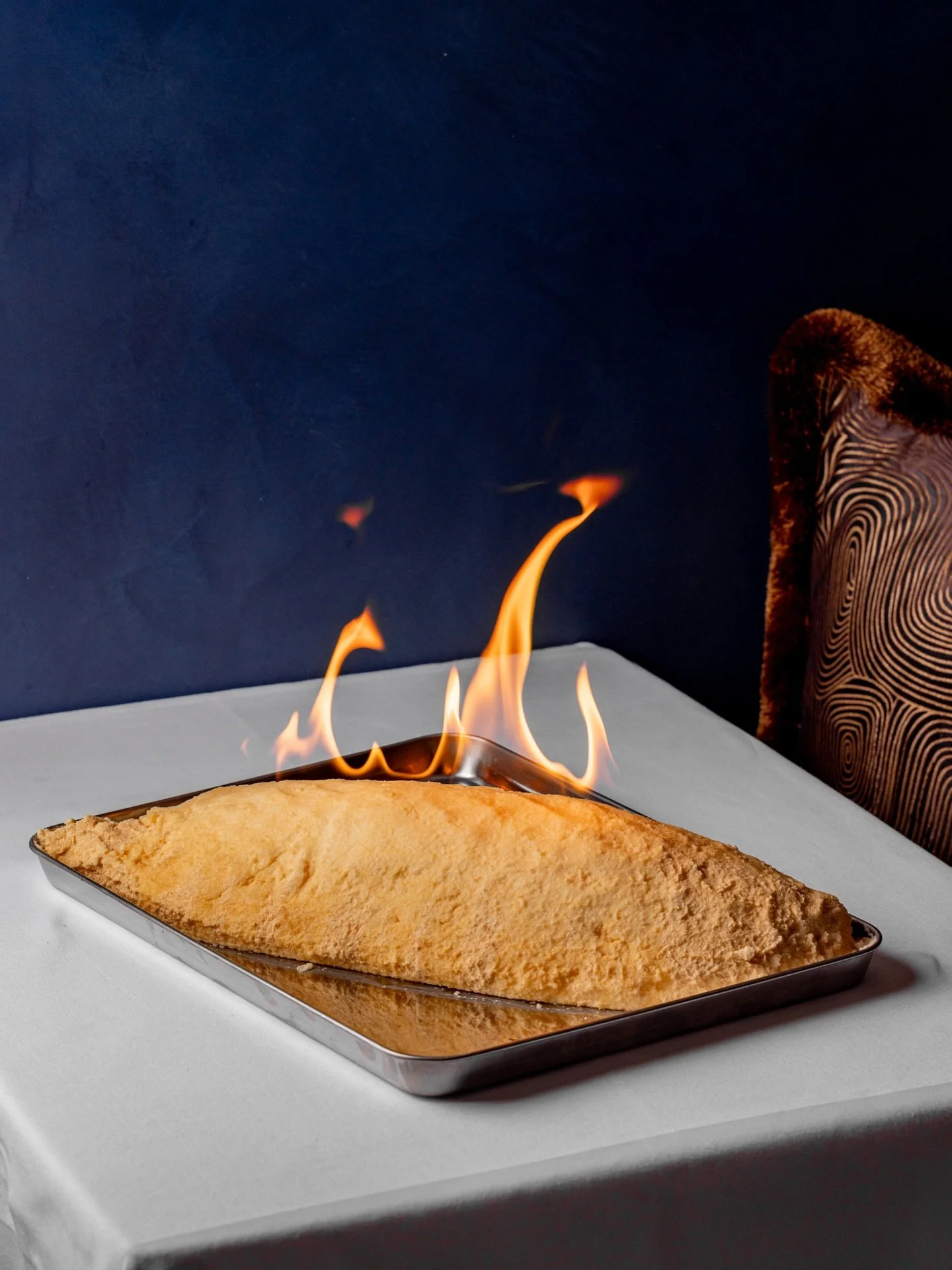 Branzino al Sale&nbsp;

Whole sea bass baked in rosemary salt - a traditional Italian technique that seals in moisture and gently seasons the fish as it cooks.&nbsp;

At the table, the crust is cracked open with flame, revealing the delicate flesh wi