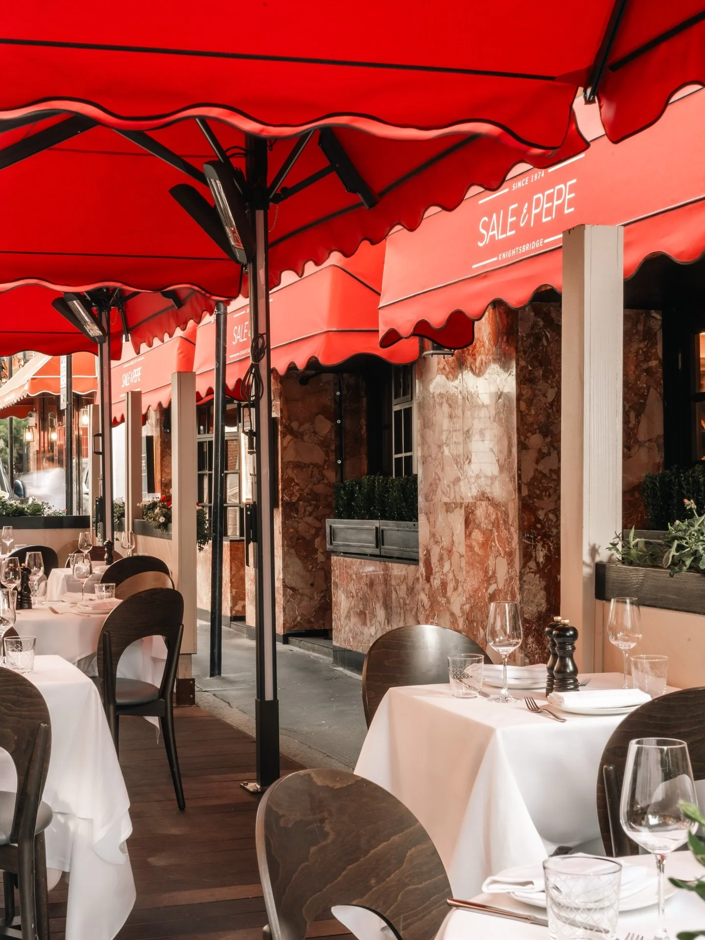 A table in the sun, something cold in your glass, and the afternoon stretching gently ahead.

Join us on the terrace. Now open.