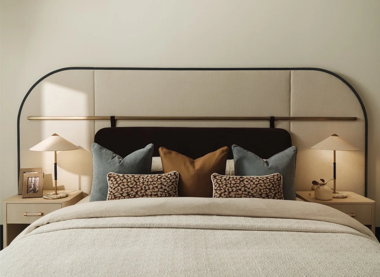 Luxury bedroom at The Bryanston, Hyde Park featuring a bespoke upholstered headboard, brass accents, designer bedside tables and contemporary interior design by Burbeck Interiors.