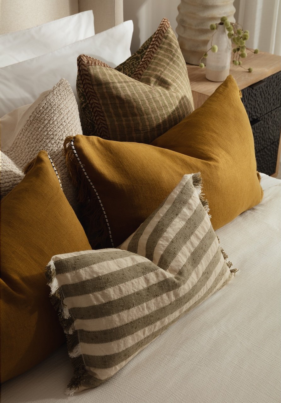 Curated interior furnishing collection featuring luxury cushions, designer textiles and bespoke soft furnishings. Thoughtfully layered to create warmth, comfort and sophistication within premium residential interiors by Burbeck Interiors.
