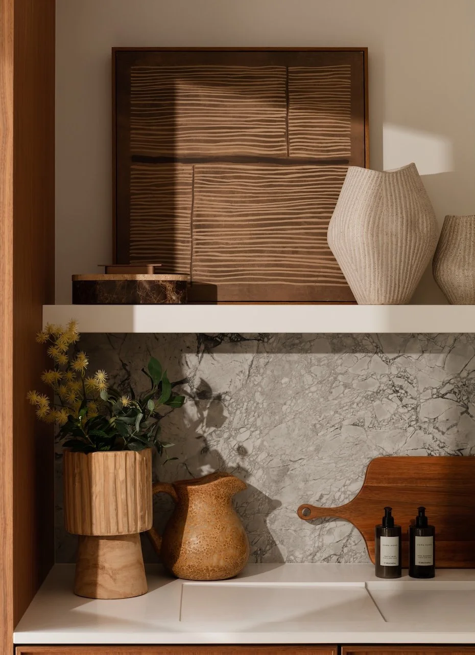 Luxury complete furnishing package showcasing bespoke joinery, natural stone finishes, designer accessories and curated styling details. Thoughtfully designed by Burbeck Interiors to create elegant, turnkey residential interiors.