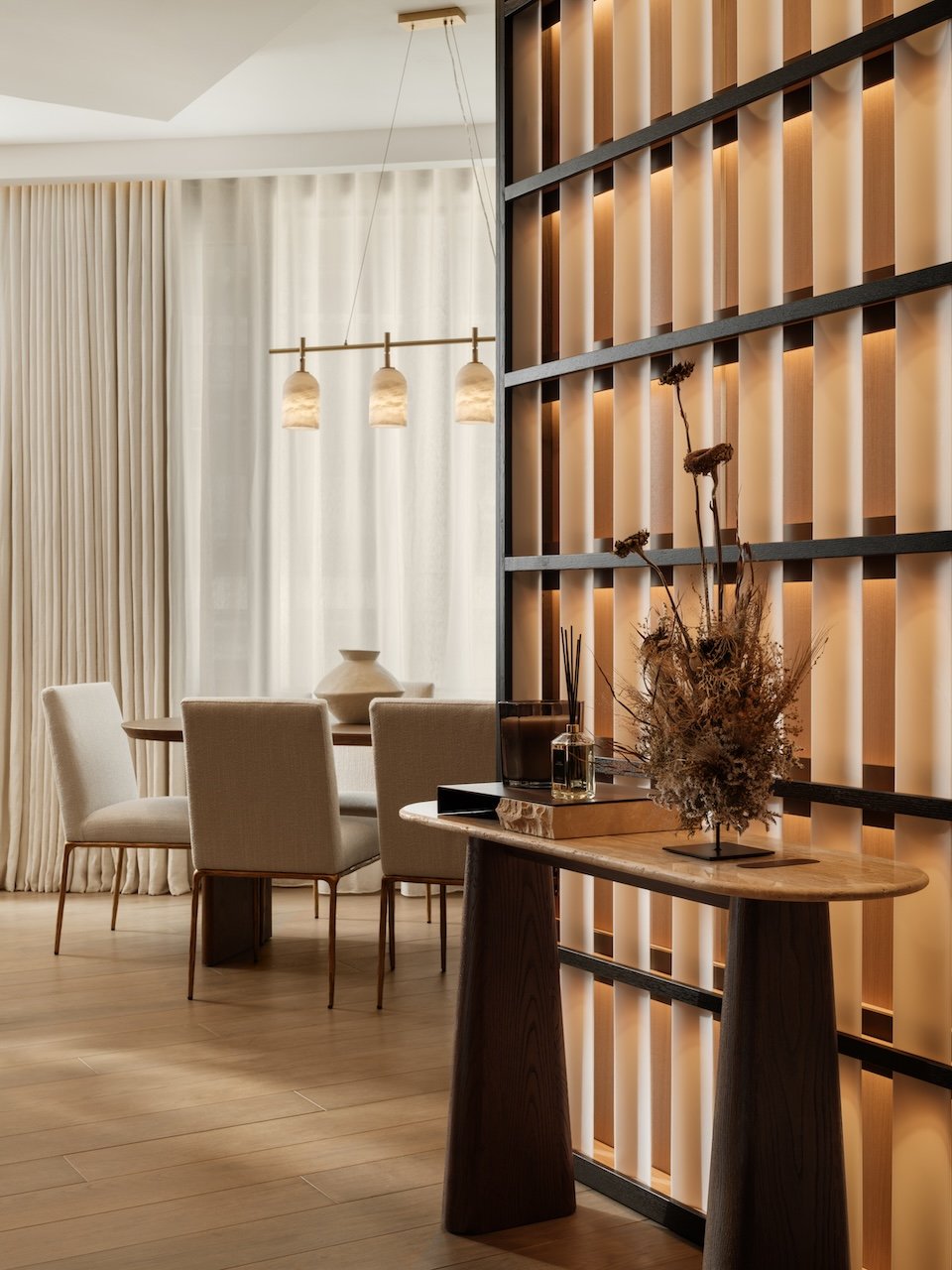 This luxury show apartment at The Bryanston, Hyde Park features bespoke architectural joinery, feature lighting, designer dining furniture and carefully curated accessories. Designed and styled by Burbeck Interiors, the scheme creates a sophisticated