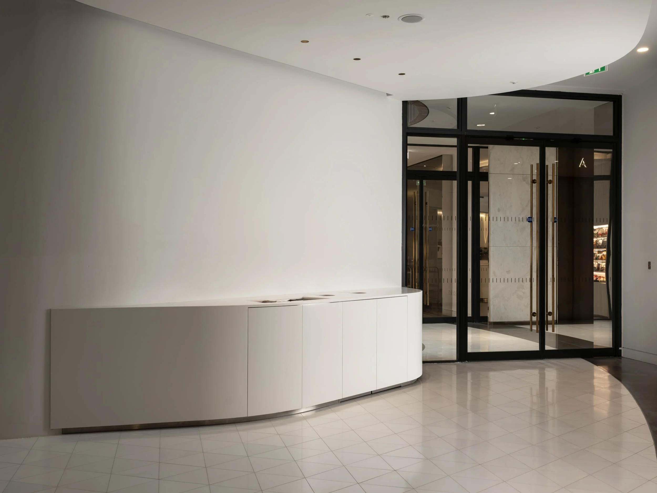 White curved waste counter in modern café interior, London