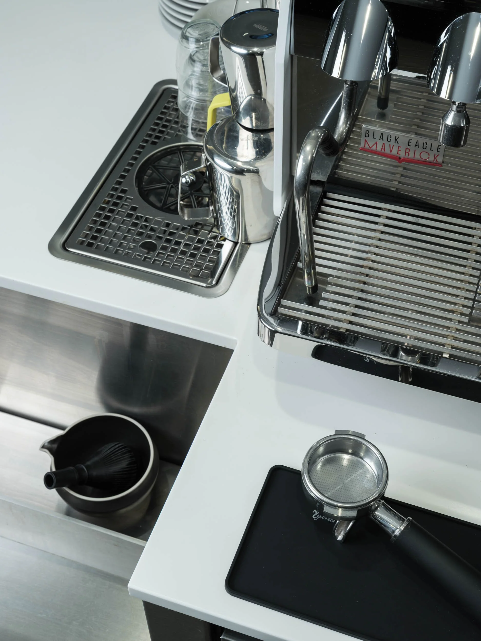 Espresso machine on white coffee counter, café interior photography, London