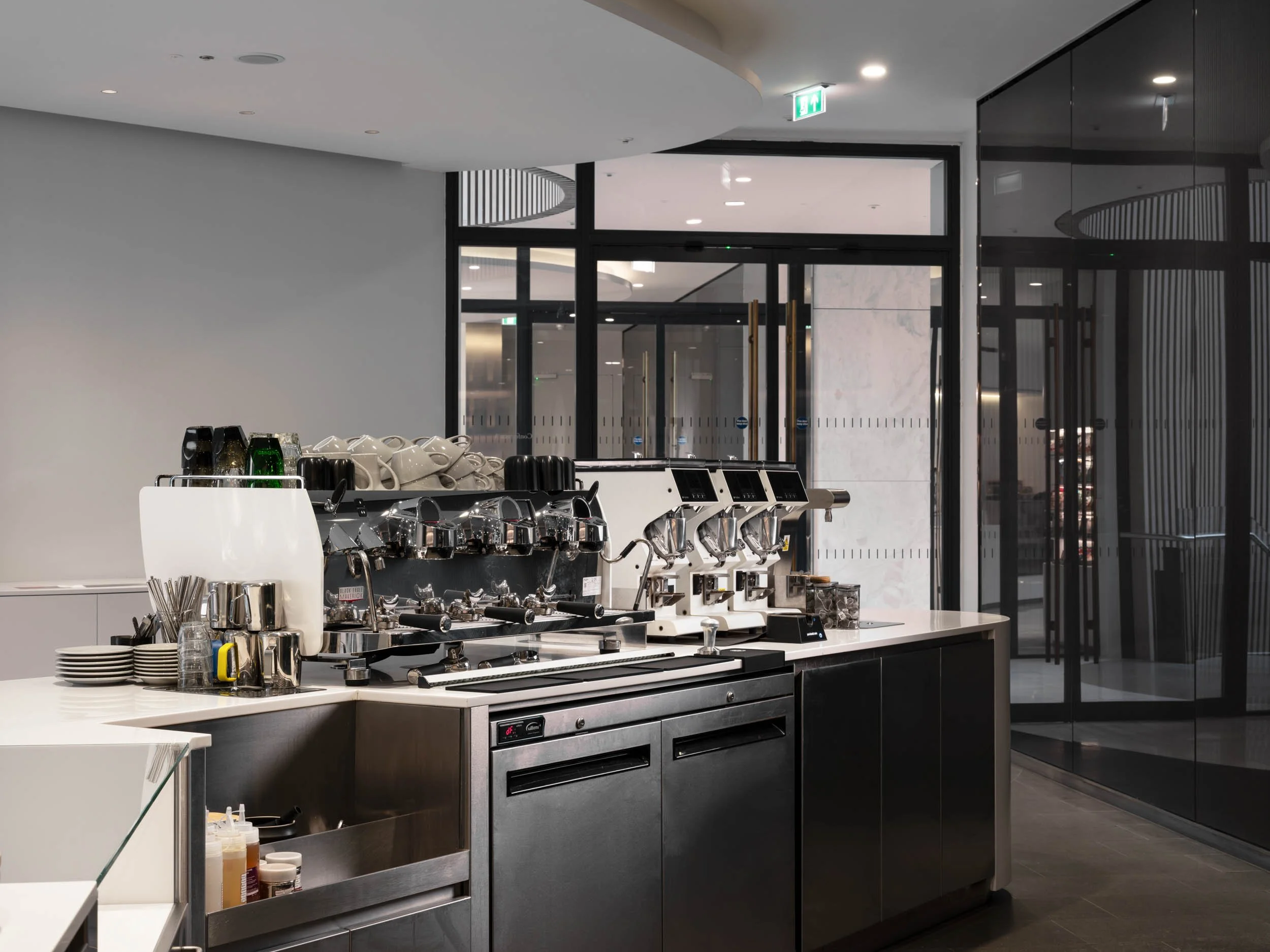 Espresso machine on white coffee counter, café interior photography, London