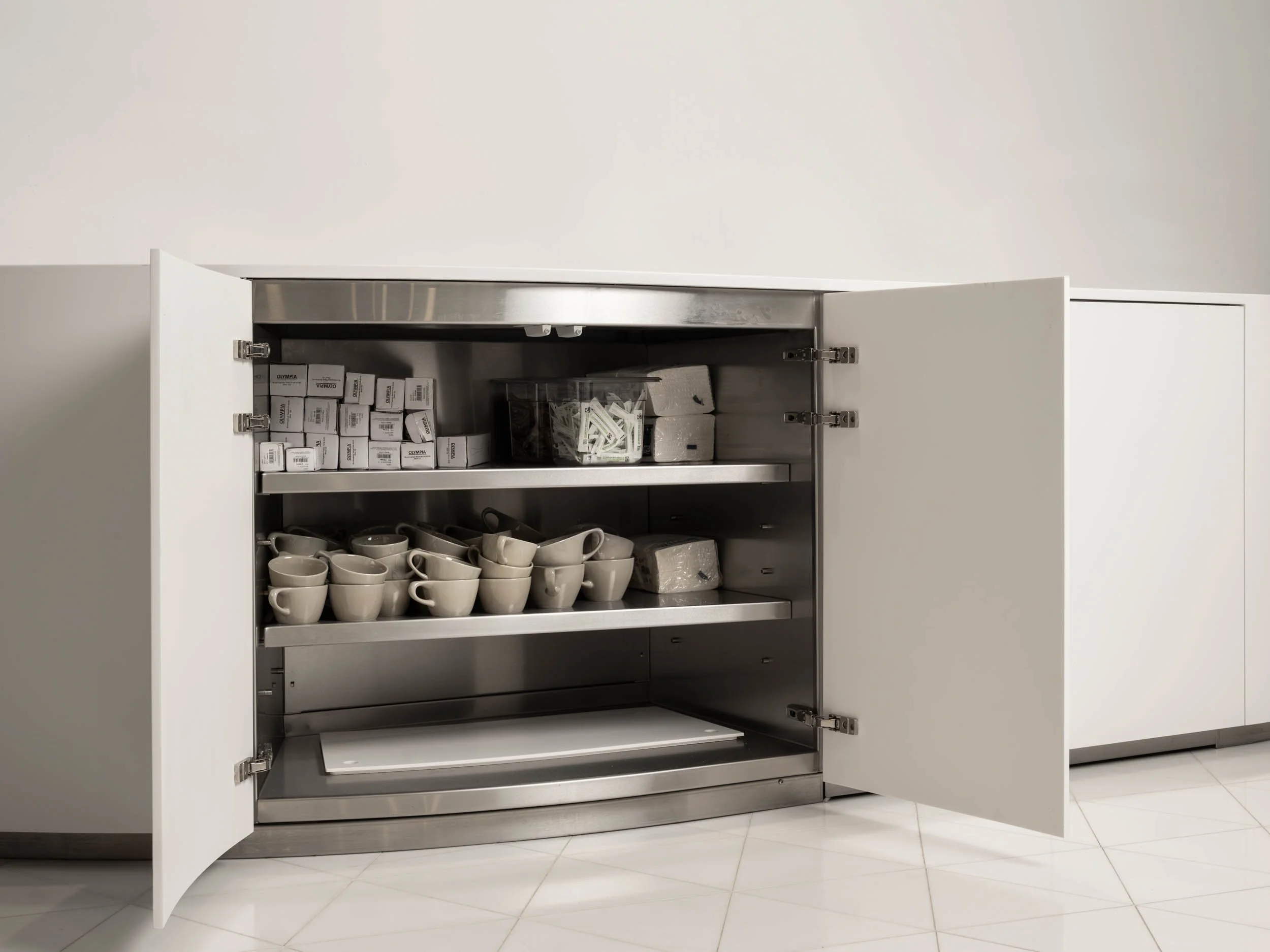 White curved waste counter interior in modern café interior, London
