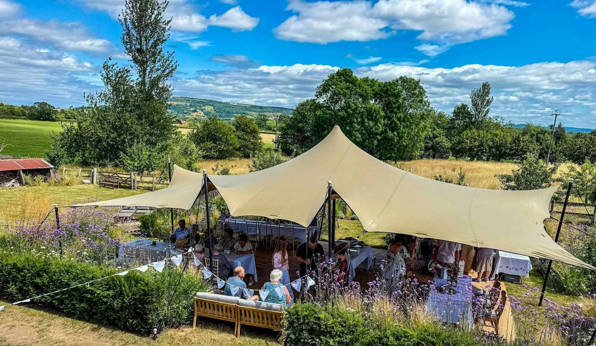 stretch-tent-garden-party-guests-hills.jpg