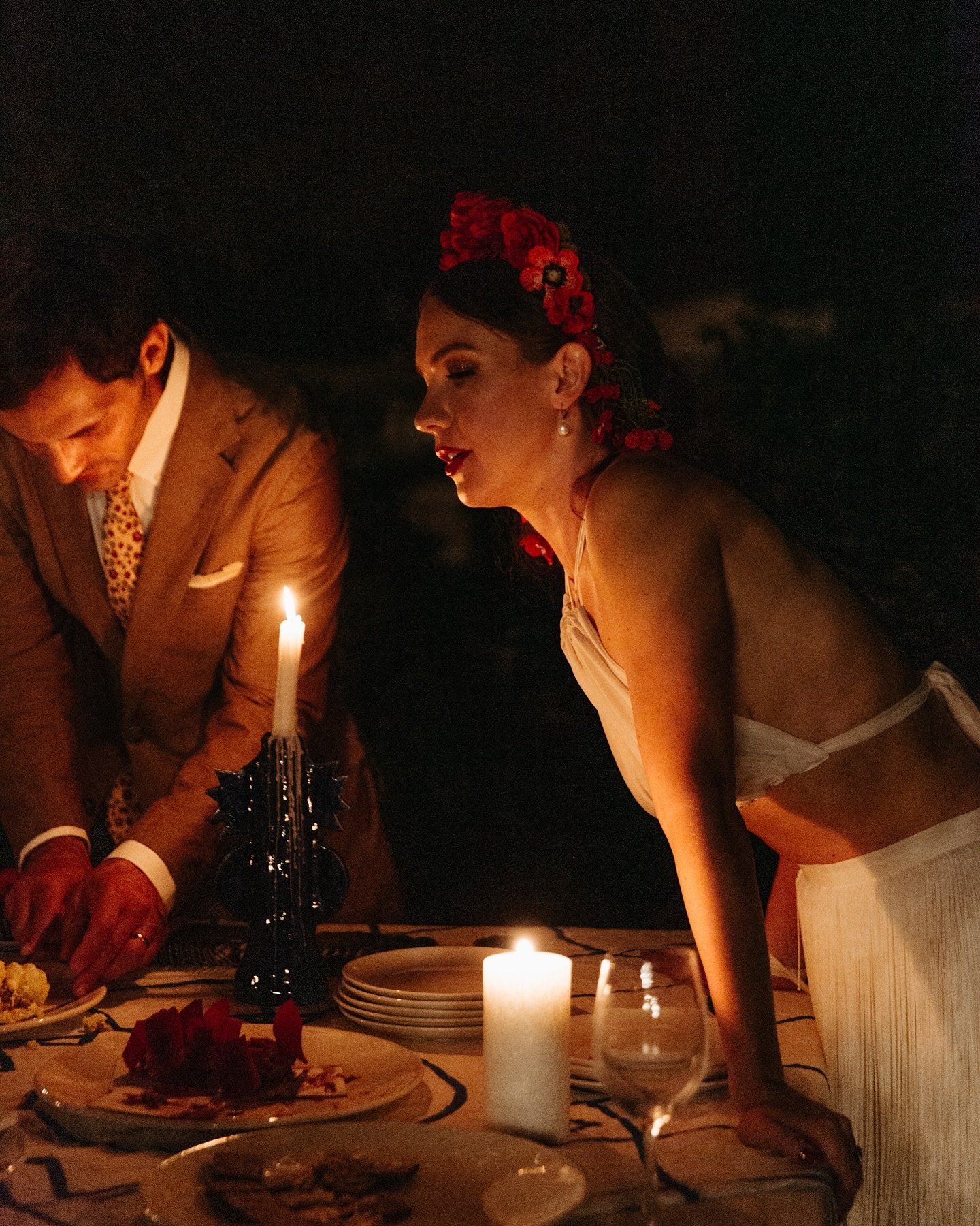 After dark at the dessert table. A favourite photo of C + M&rsquo;s magical Barcelona destination wedding.

the bride and groom are lit by warm natural candle light. 

#2025weddings #devonweddingphotographer #weddinginspiration #candledecor #naturall