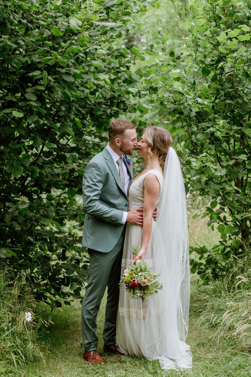 Bride and Groom portait in the woods at higher holcombe devon