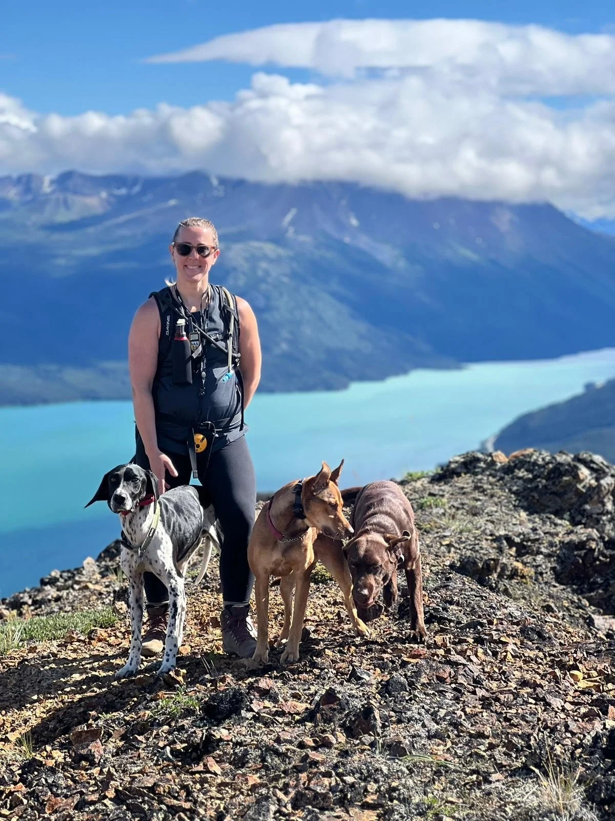 A picture of counsellor and therapist, Katie Couperus hiking with her dogs in the Yukon.