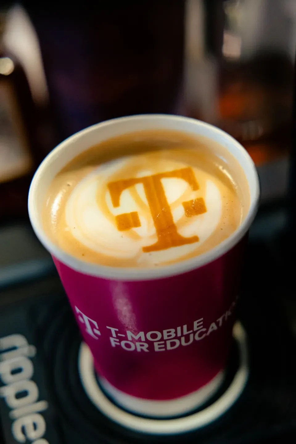 Custom logo printed on latte foam using a Ripple printer at a corporate brand activation coffee bar in Nashville