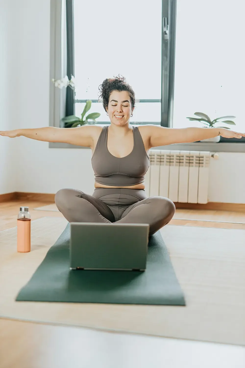 Woman doing yoga as part of fertility plan with Dr. Kirsten Kessler