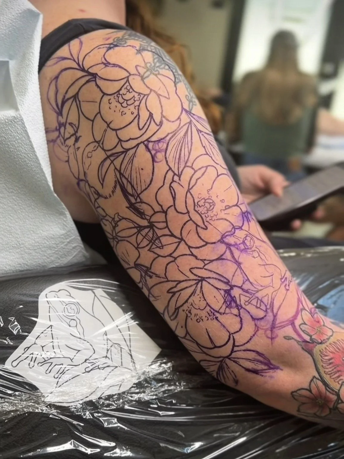 flower tattoo stencil on client arm