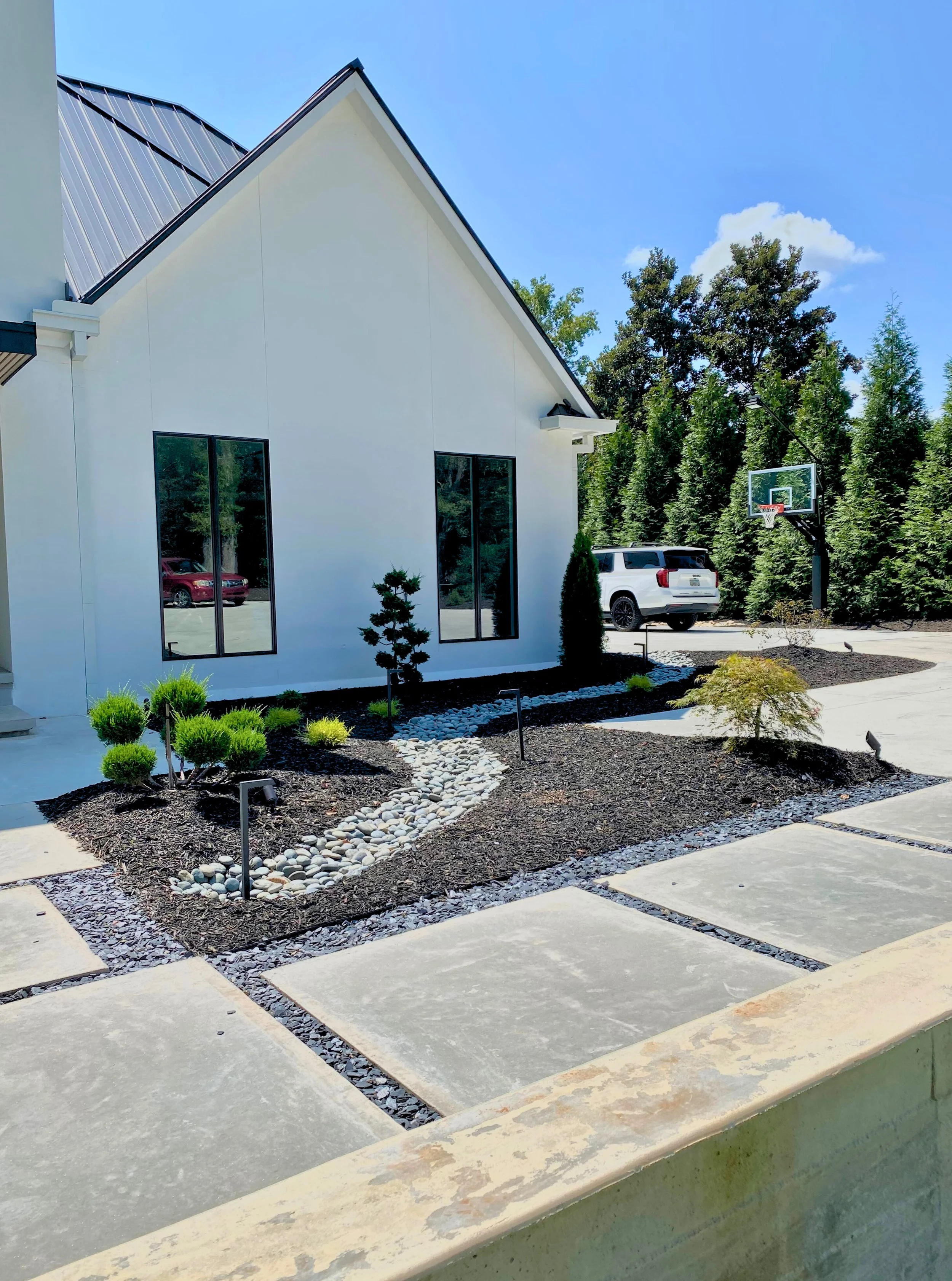 Modern landscaping with fresh black mulch