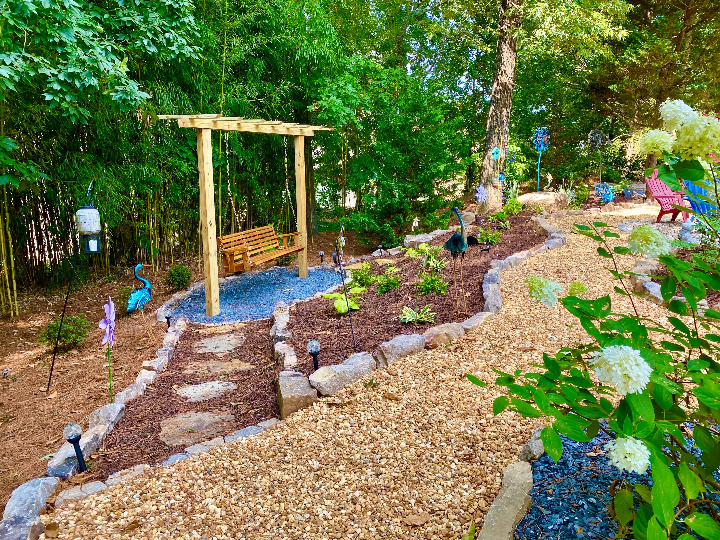 Pea gravel path with pine straw and flagstone steps.