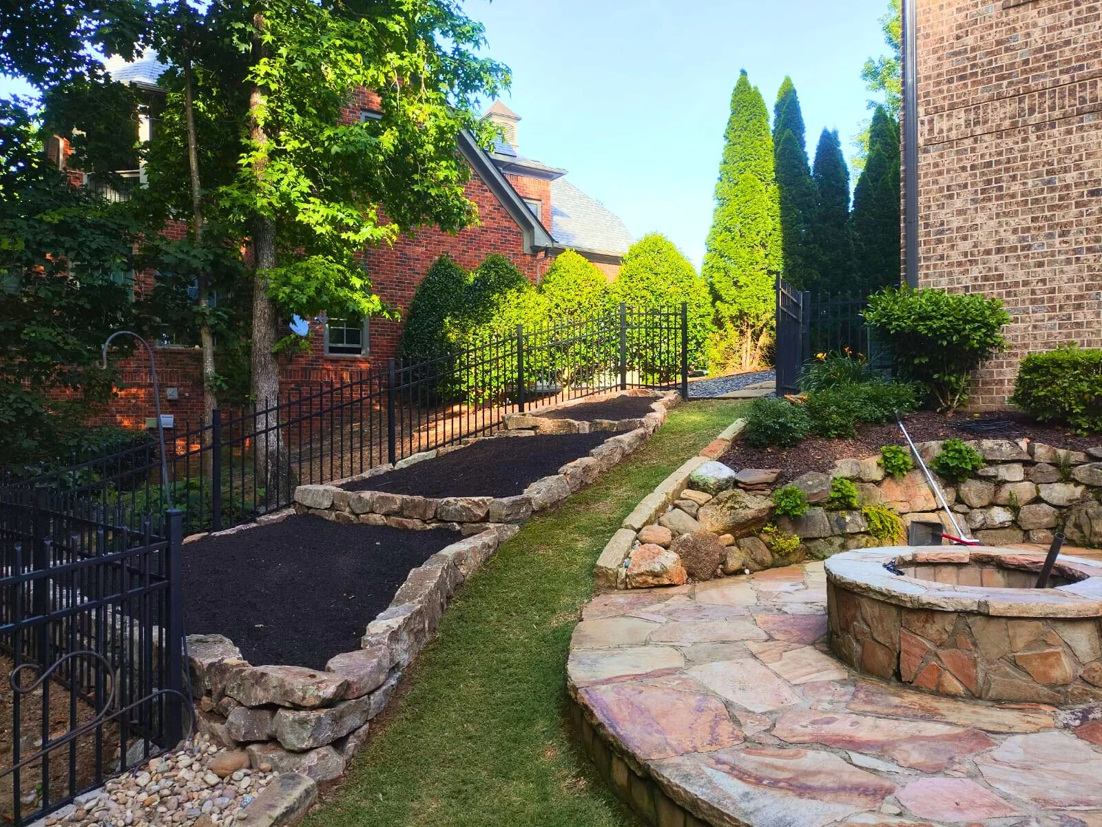 Stacked stones and flagstone firepit 