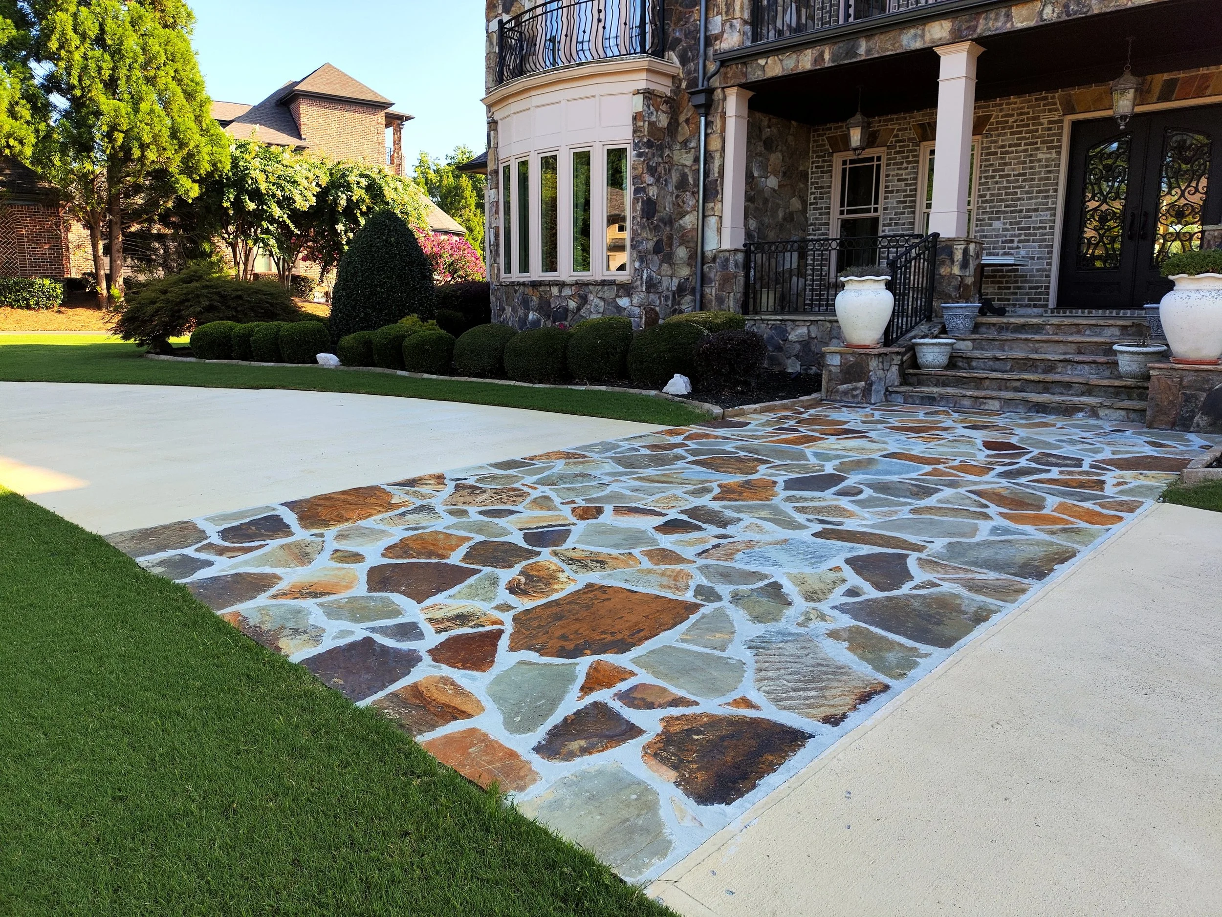 Flagstone in concrete driveway section