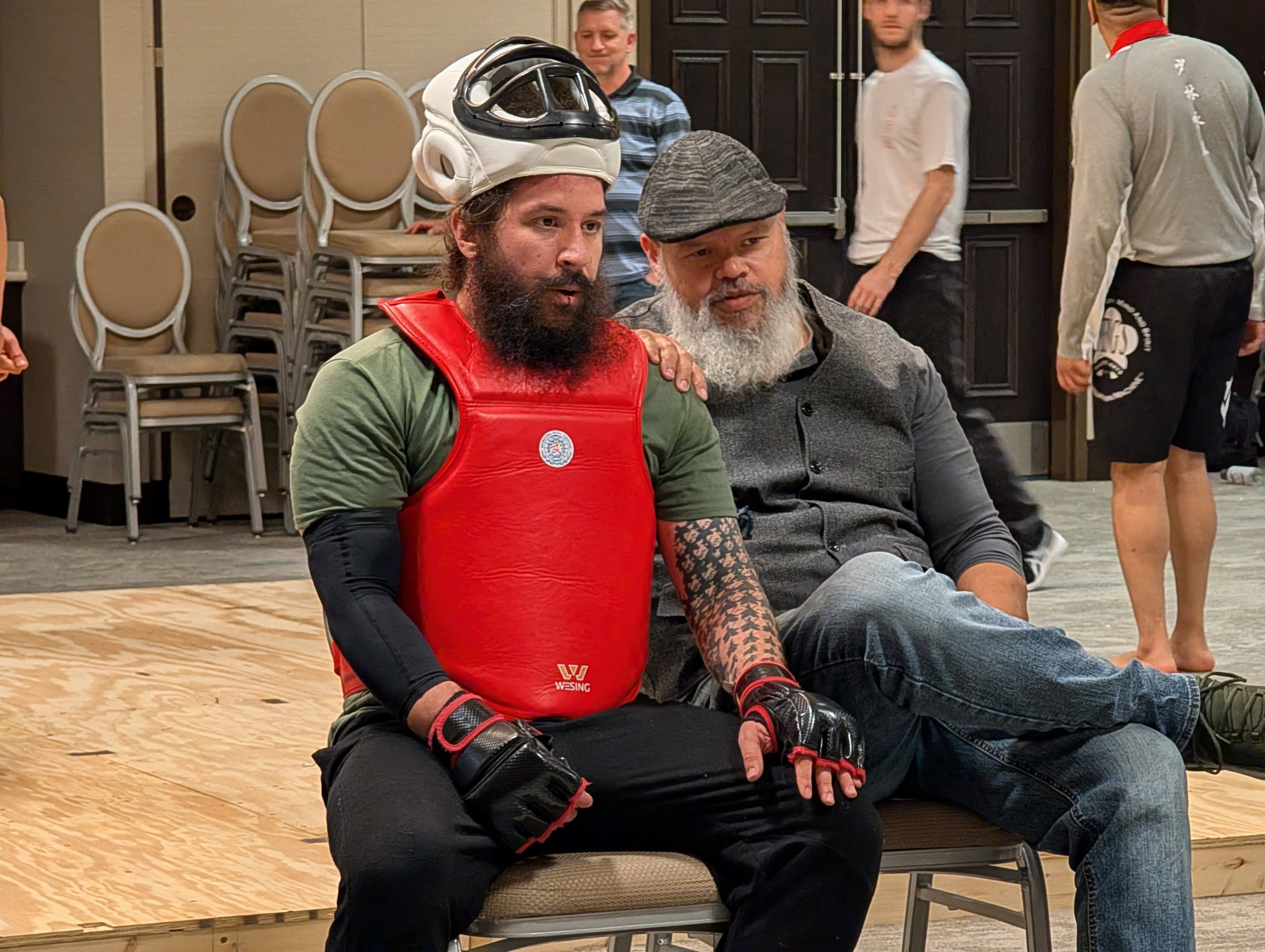 Coaching between Mai San Jong rounds at the 2025 National Wing Chun Team Trials. A sport similar to Sanda, in a smaller space in order to promote using Wing Chun.