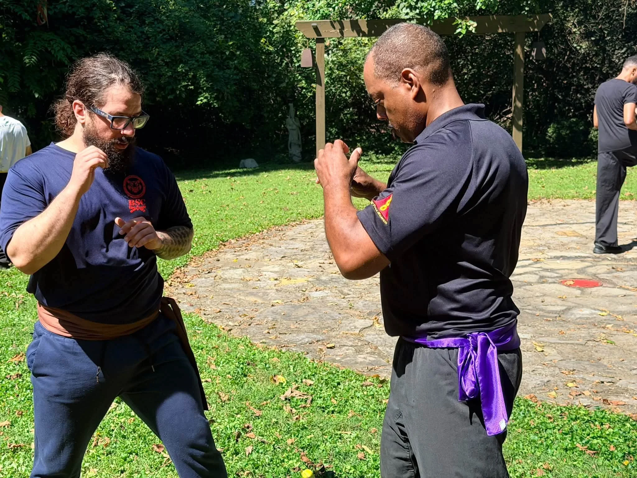 Red Tiger Dai Sihing Alex working on Wing Chun bridging drills with his sisuk (younger kung fu uncle)