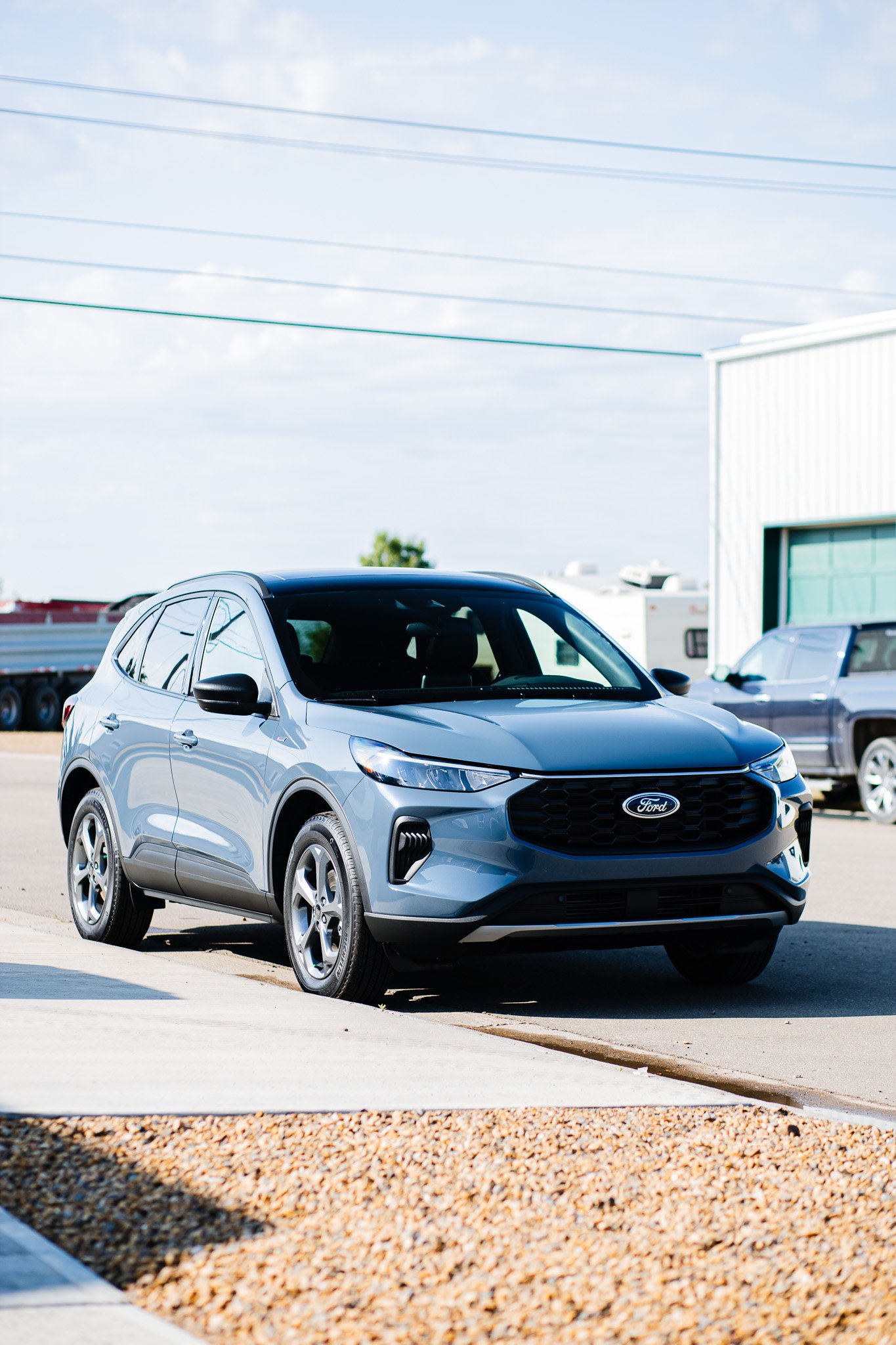A silver Ford escape SUV with paint protection film and ceramic coating parked on the side of the street in Hanna, Alberta.
