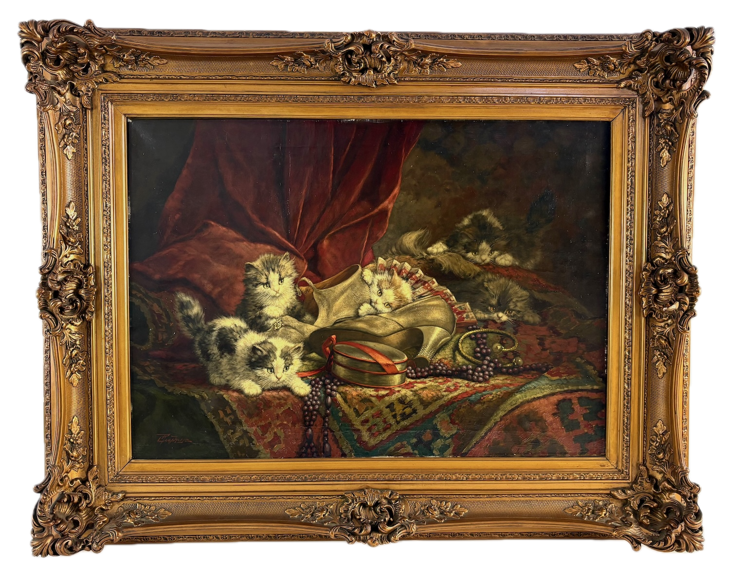 Cornelis Raaphorst classical oil painting of  kittens resting on a richly decorated cloth with a red curtain in the background, surrounded by jewelry and a pair of shoes, framed in an ornate gold frame.