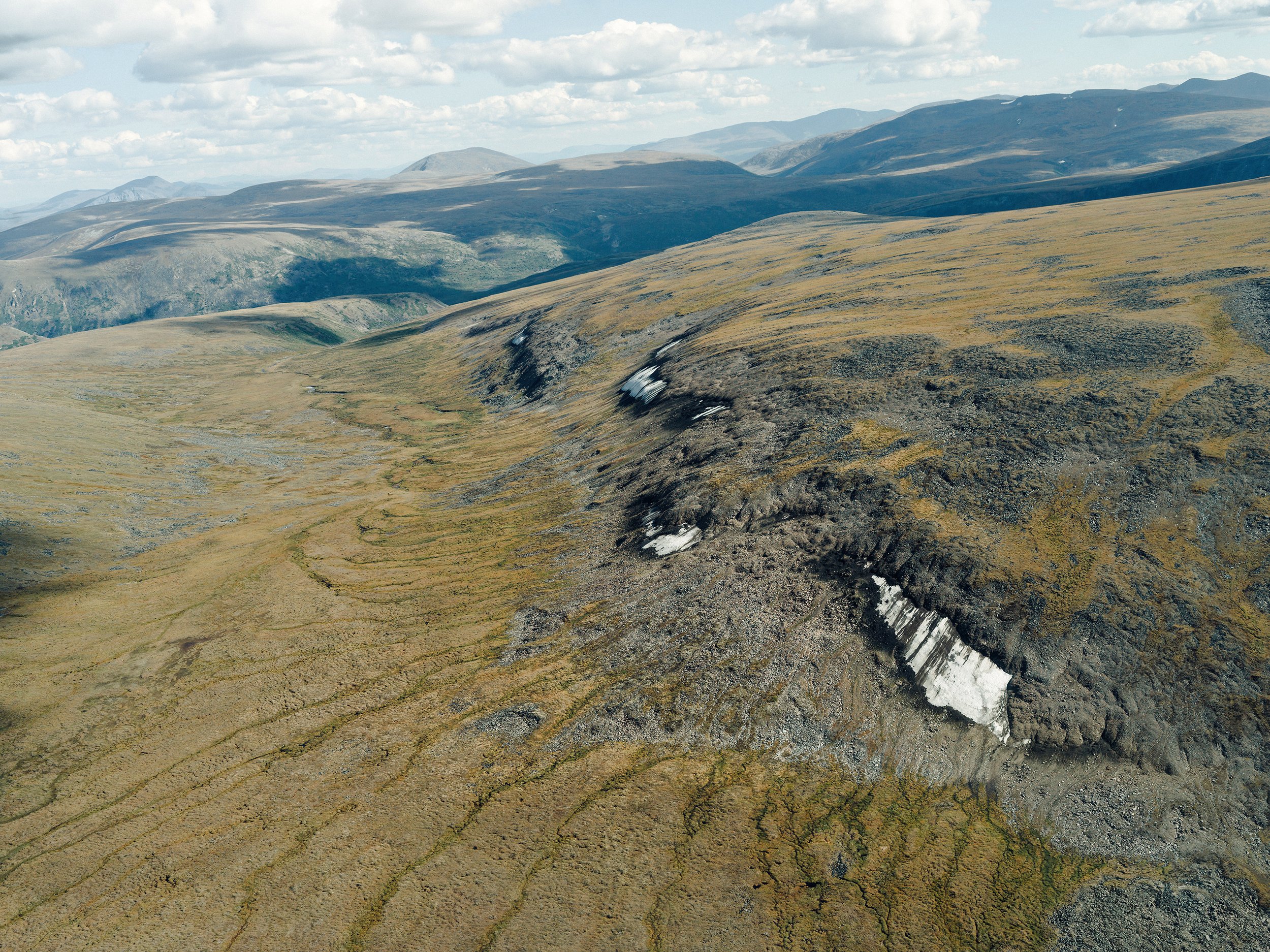 Glaciers form gradually over time, and when they accumulate a sufficient mass, they flow. Due to their dynamic nature, objects lost within a glacier are subjected to compression, distortion, and a loss of contextual information. Ice patches on the ot