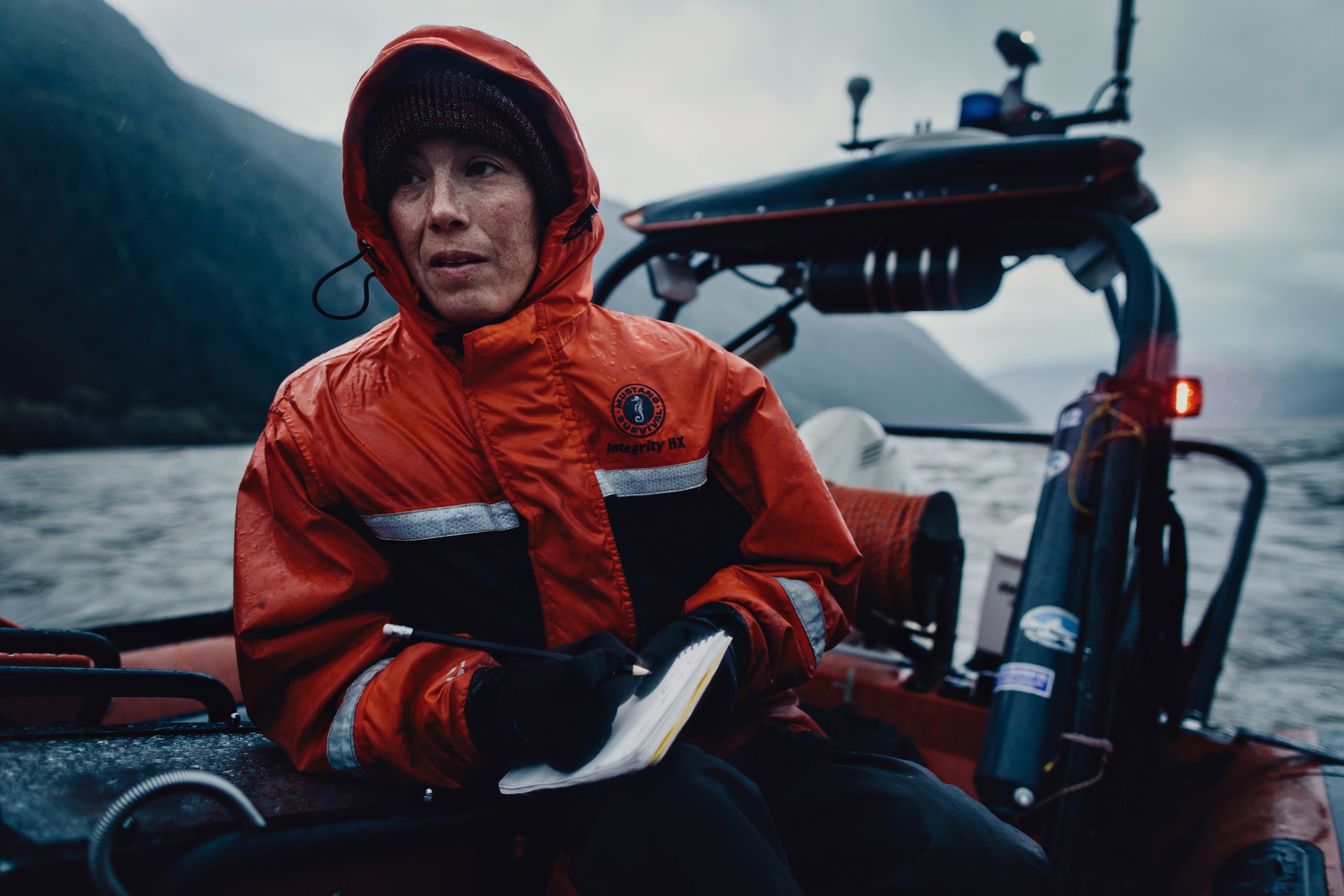 SCIENTIST AMY TABATA RECORDS COORDINATES OF A WATER SAMPLE TAKEN OFF THE CENTRAL COAST OF BRITISH COLUMBIA, CANADA. USING GENE SEQUENCING, SCIENTISTS ARE NOW ABLE TO PAINT A MUCH FULLER PICTURE OF WHICH MARINE SPECIES ARE WHERE, SIMPLY BY TESTING THE